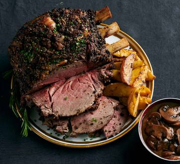 Standing Rib Roast with Potatoes and Mushroom Red Wine Jus image