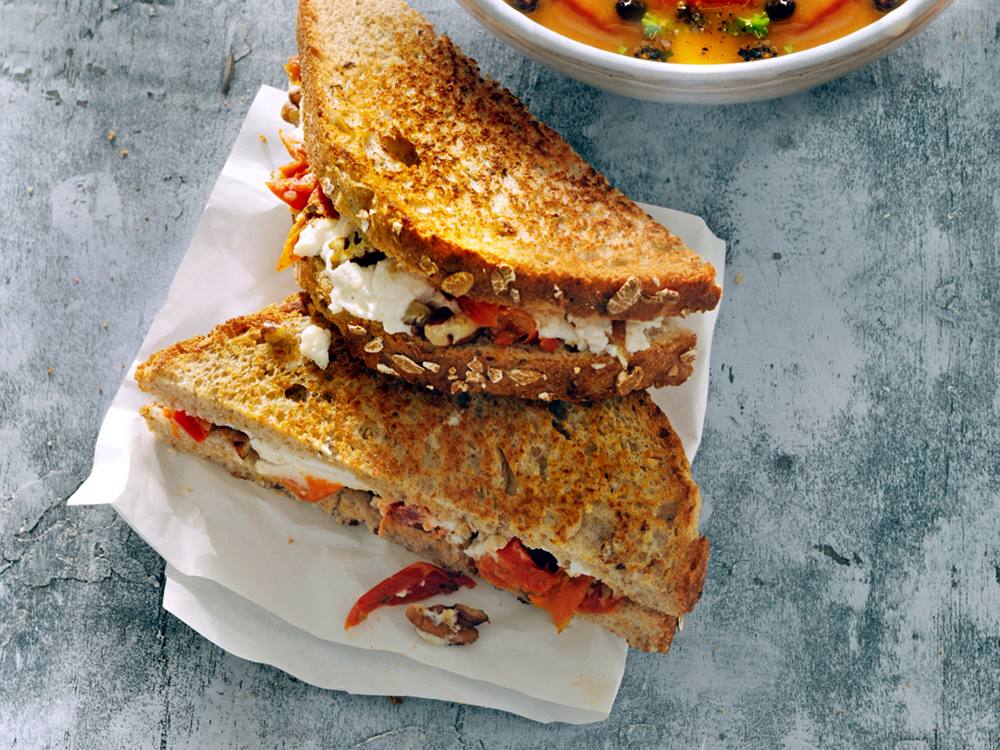 Pecans bring unexpected crunch to this sandwich that contrasts tart dried tomatoes with creamy goat cheese.