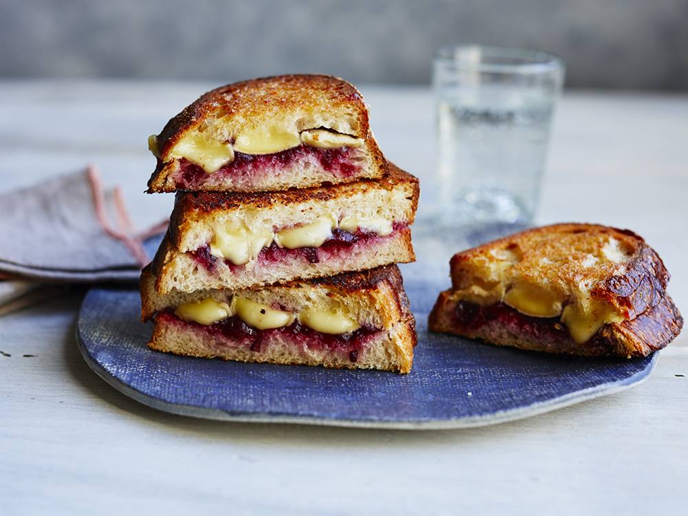 Spread 2 sourdough bread slices with softened butter. Spread the other side of one slice with leftover cranberry sauce; top with sliced Brie and the remaining bread slice, butter-side up. Cook in a skillet until cheese melts.